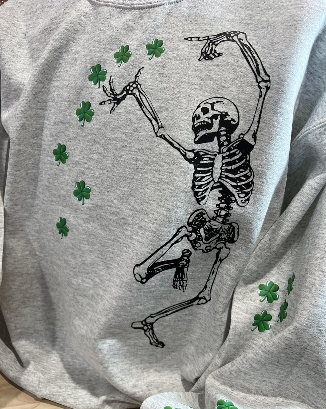 SKELETON WITH CLOVERS DANCING ALL OVER
