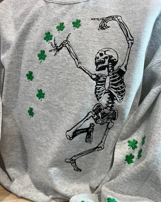 SKELETON WITH CLOVERS DANCING ALL OVER